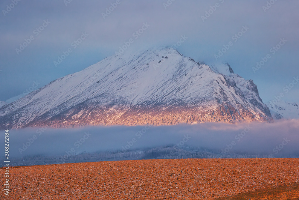 Fototapeta premium Peaks of High Tatras at dawn, beautiful outdoor winter background