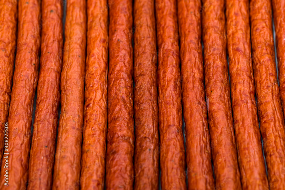 Kabanos or Cabanossi Thin Dry Smoked Polish Sausage Background. Selective focus. Kabanos or Cabanossi Thin Dry Smoked Polish Sausage Background. Selective focus.