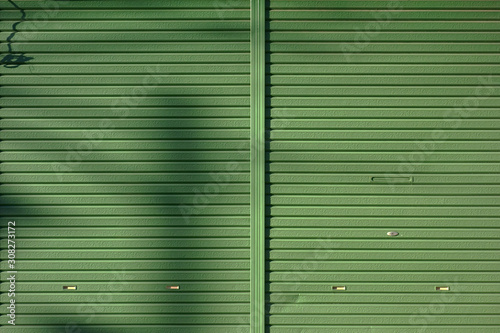 Metallic roll up door and shadow background