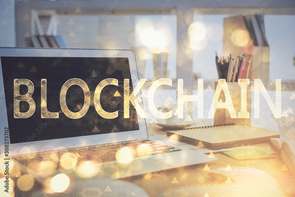 Multi exposure of blockchain theme hologram and table with computer background. Concept of bitcoin crypto currency. Multi exposure of blockchain theme hologram and table with computer background. Concept of bitcoin crypto currency.
