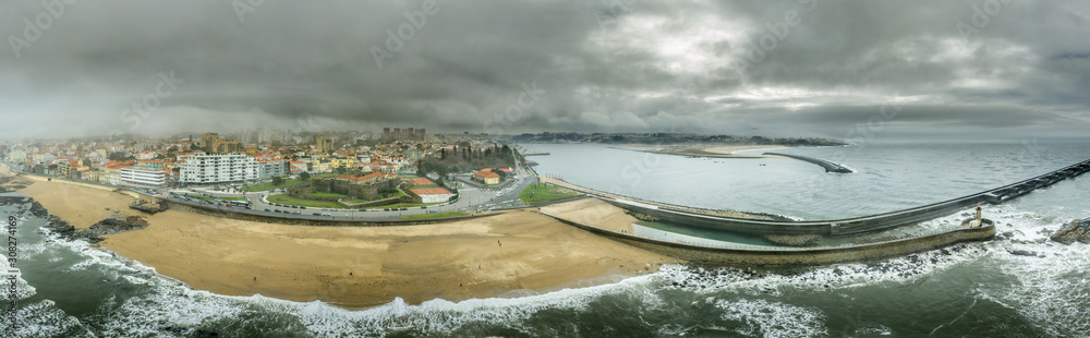 Aerial view of Foz de Douro at the mouth of the Douro river as it flows into the Atlantic ocean with Forte de Sao Joao Baptista guarding the entrance to Porto