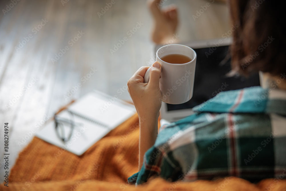 Close up of lady sitting with cup of hot drink Close up of lady sitting with cup of hot drink