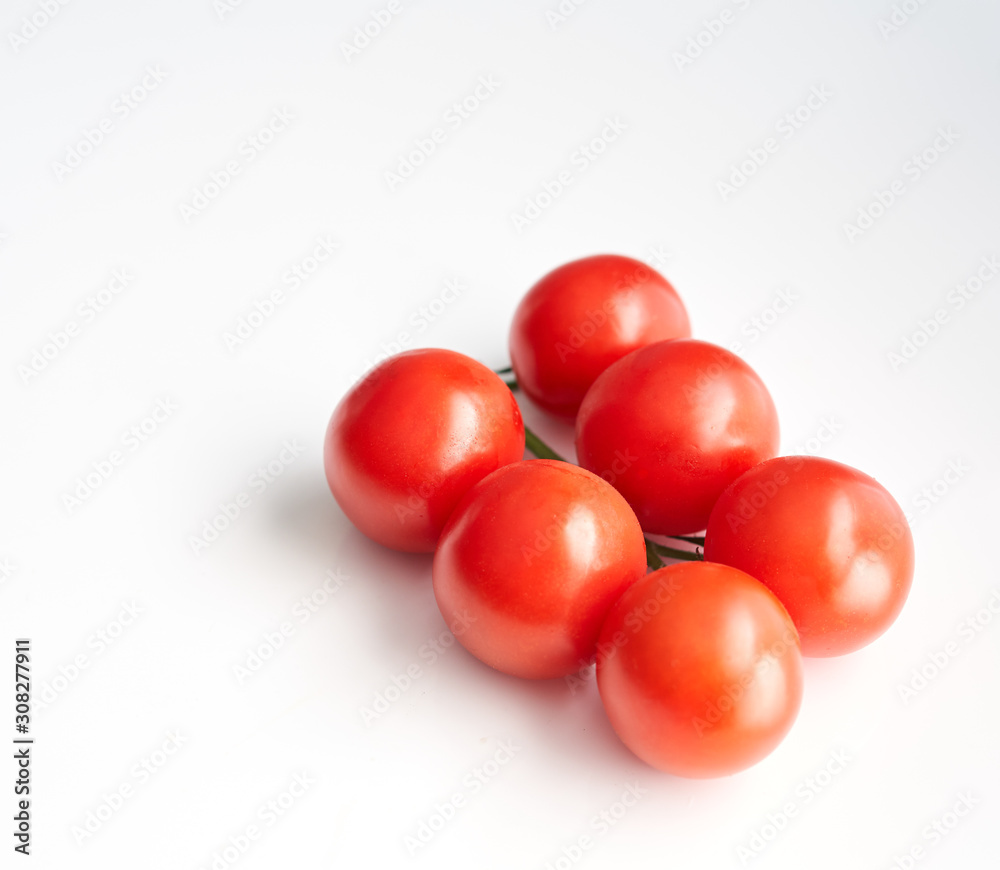 red cherry tomatoes on a white background red cherry tomatoes on a white background