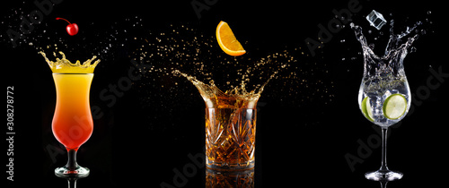 set of cocktail glasses splashing on black background