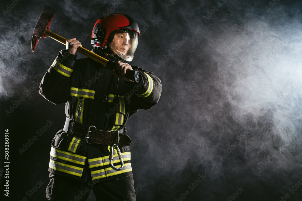 Naklejka premium caucasian fireman hero, ready to protect all humanity from fire, professional firefighter in protective uniform