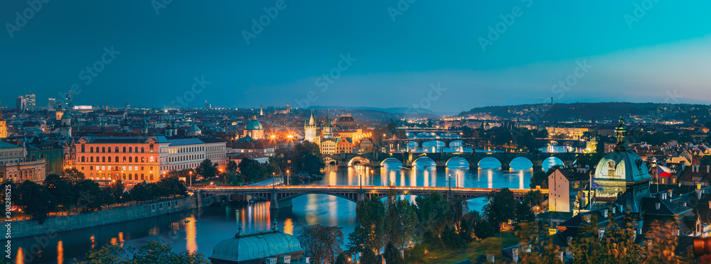 Prague, Czech Republic. Evening Panoramic View Of Evening Cityscape In Night Lighting. Charles Bridge, Manes Bridge, Straka Academy. Famous Landmarks, UNESCO World Heritage - obrazy, fototapety, plakaty 
