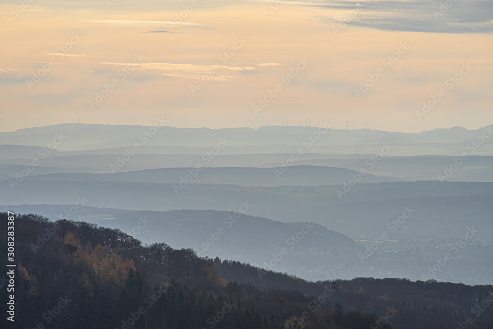 View over the hills at river Rhine in the light of an autumnal late afternoon sun.