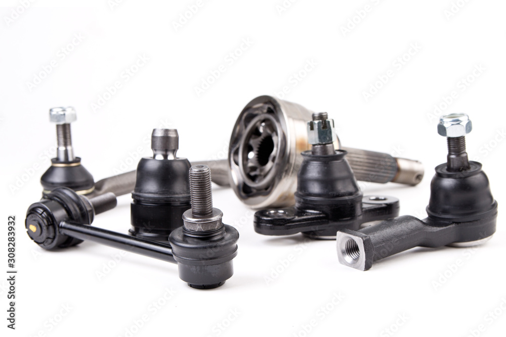 Suspension spare parts for cars isolated on white background. New car parts. Suspension spare parts for cars isolated on white background. New car parts.