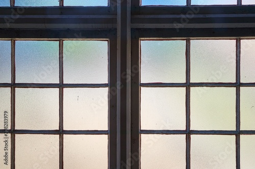 Window in a dim old building interior, industrial hall