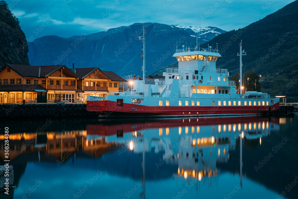Flam, Norway. Touristic Ship Boat Moored Near Berth In Sognefjord Port. Summer Night. Norwegian Longest And Deepest Fjord. Famous Natural Norwegian Landmark And Popular Destination