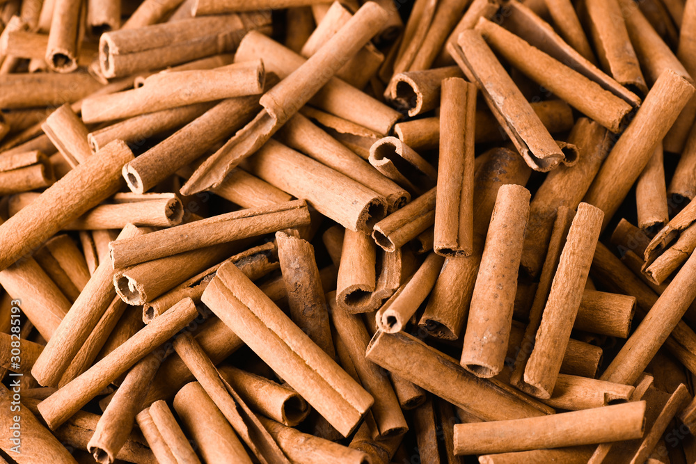 Cinnamon background. Pile of cinnamons stick top view. Cinnamon background. Pile of cinnamons stick top view.