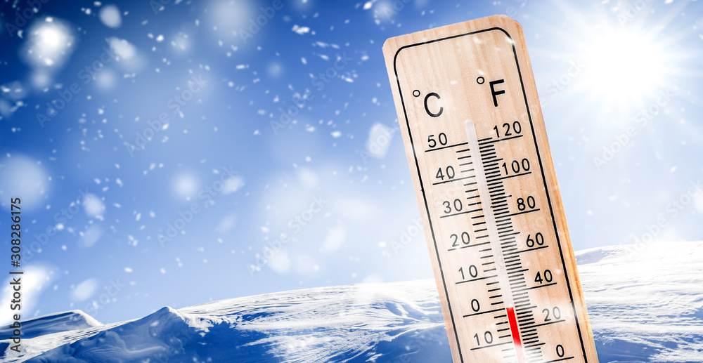 Fototapeta premium Thermometer in winter mountains near ski resort slope shows low temperatures. Temperature measure in snow fall.