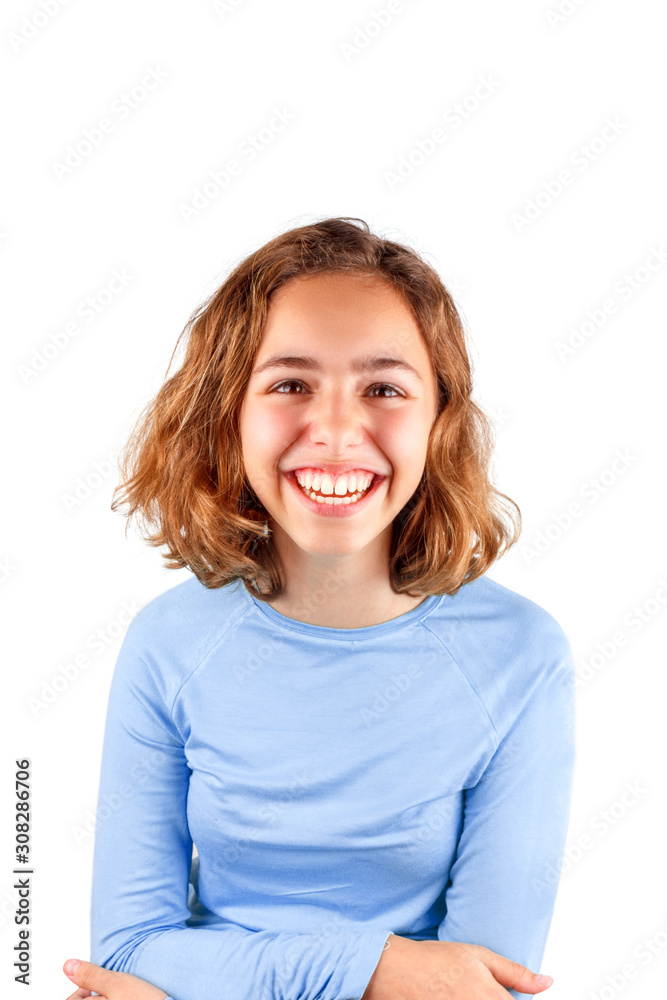 Pretty cute laughing teenager girl in classic blue t-shirt, isolated Pretty cute laughing teenager girl in classic blue t-shirt, isolated