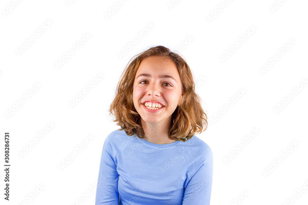 Pretty cute laughing teenager girl in classic blue t-shirt, isolated Pretty cute laughing teenager girl in classic blue t-shirt, isolated
