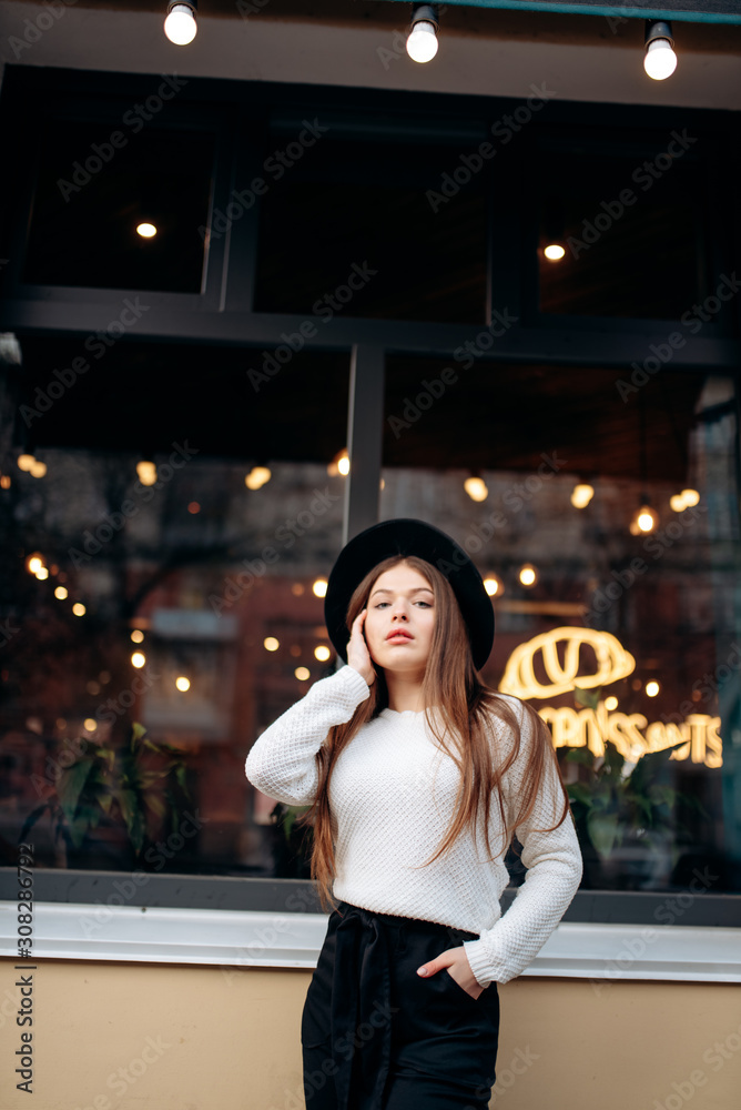 Fototapeta premium Young stylish woman in a city street