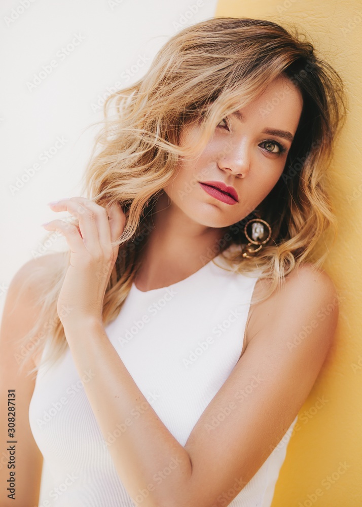 Portrait of beautiful young woman with makeup in fashion white clothes Portrait of beautiful young woman with makeup in fashion white clothes