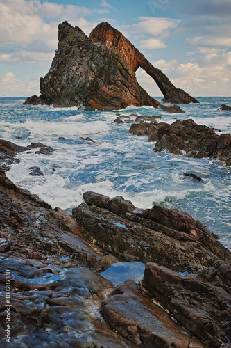 Dramatic view of the Bow Fiddle Rock, Portknockie, Scotland