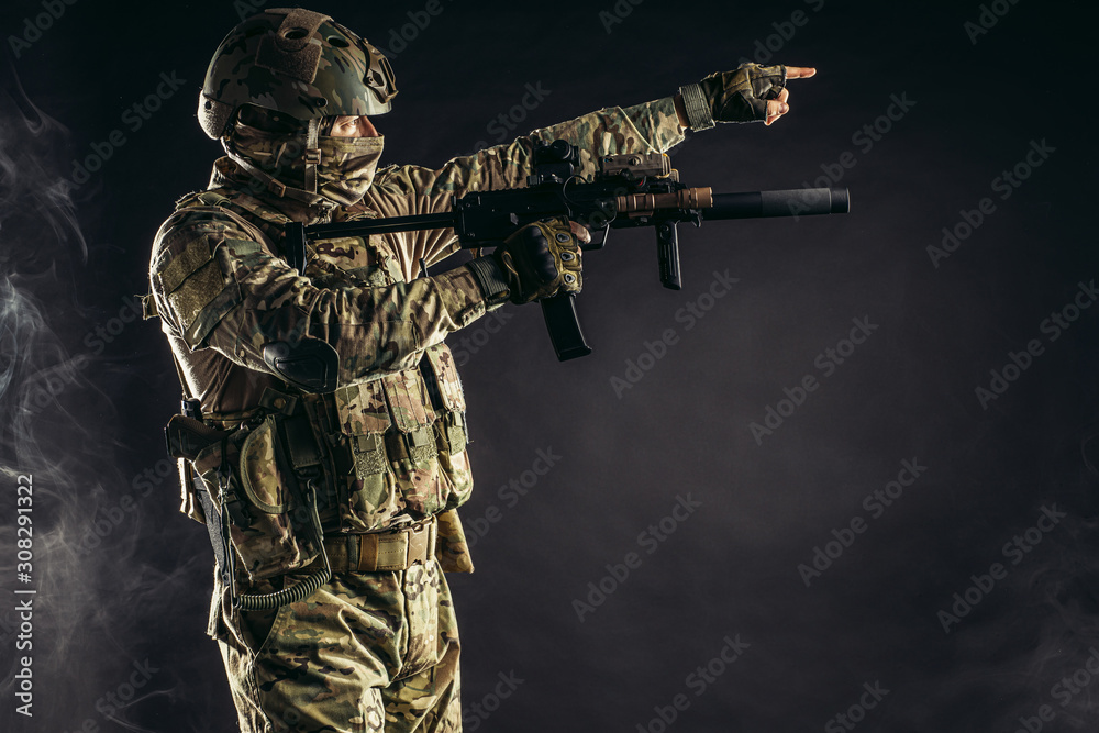 soldier man in green military uniform hold rifle in hands, shoot at side, smoke from gun in isolated space