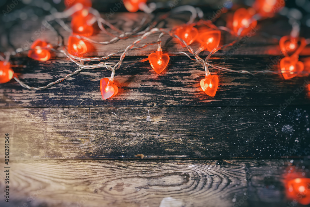 red heart lights on the wooden background red heart lights on the wooden background