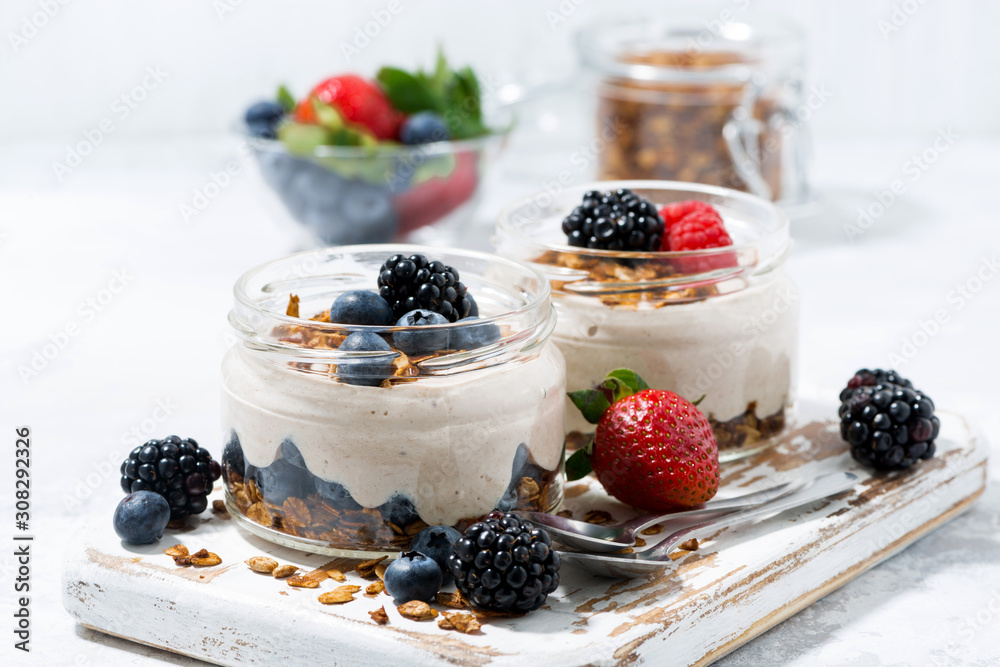 healthy creamy dessert with fresh berries on white background - obrazy, fototapety, plakaty 