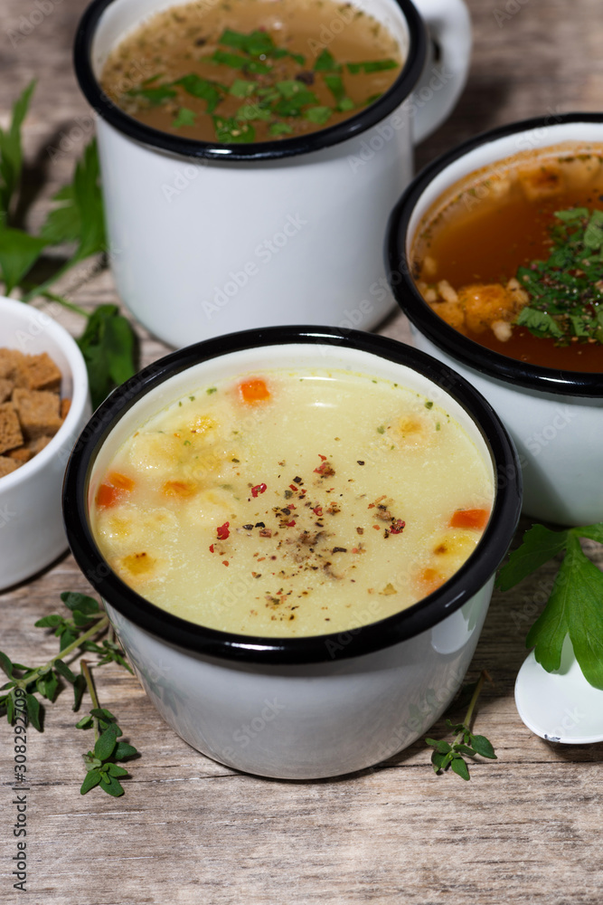 hot soups in mugs, vertical top view hot soups in mugs, vertical top view