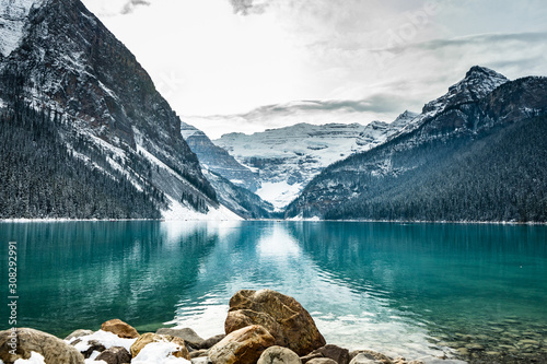 Lake louise panorama in winter with snow covered mountains, Banff National Park, Alberta, Canada photo