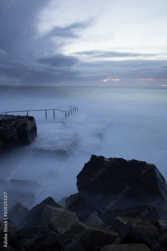 Storm submerging the pier of Doolin