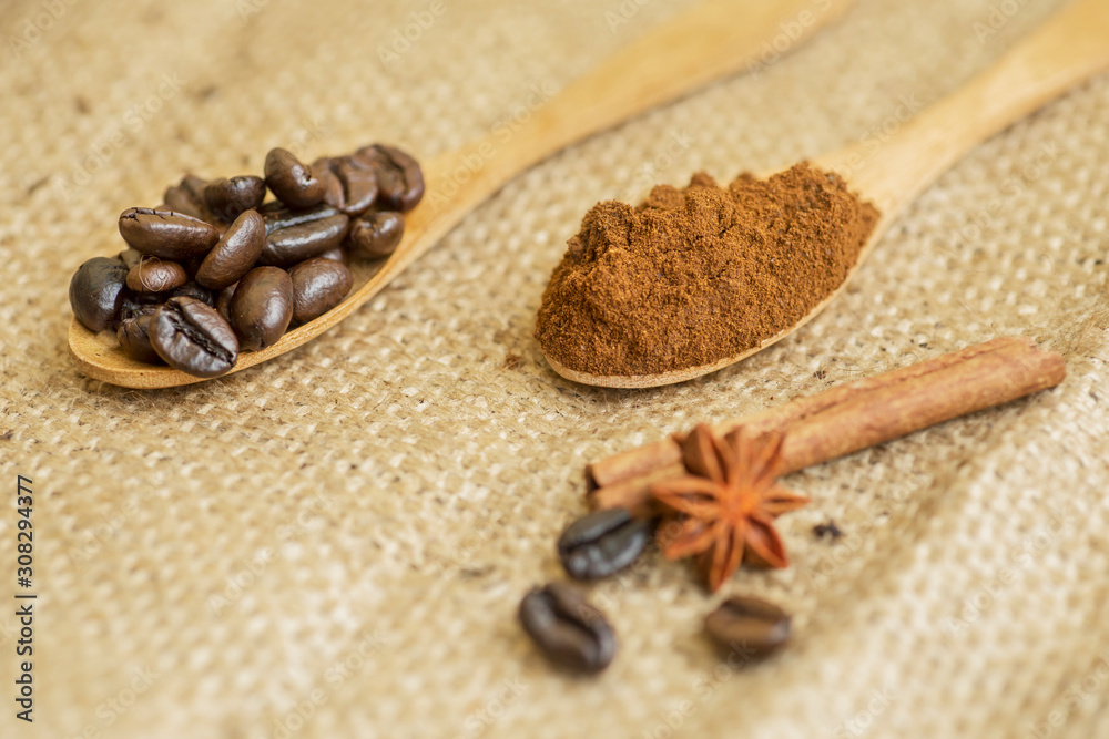 Coffee beans and powders served with a cinnamon Coffee beans and powders served with a cinnamon