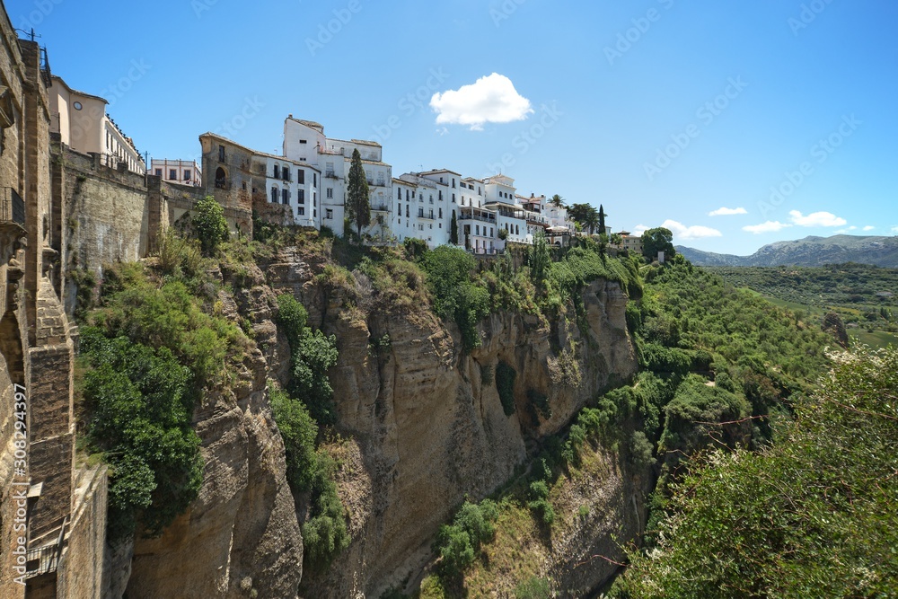 View to the town of Ronda from Ponte Nuevo (the New Bridge), Spain. This bridge spans the 120-metre-deep (390 ft) chasm that carries the Guadalevín River and divides the city of Ronda