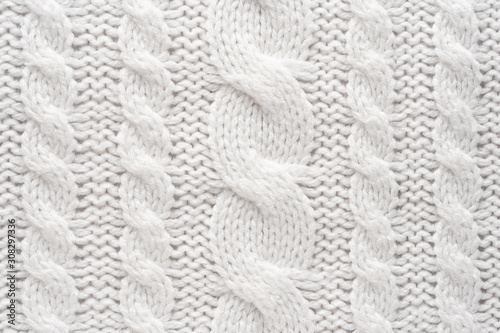 White Knit Fabric Background. Wool Sweater Texture Close Up