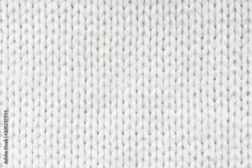 White Knit Fabric Background. Wool Sweater Texture Close Up photo