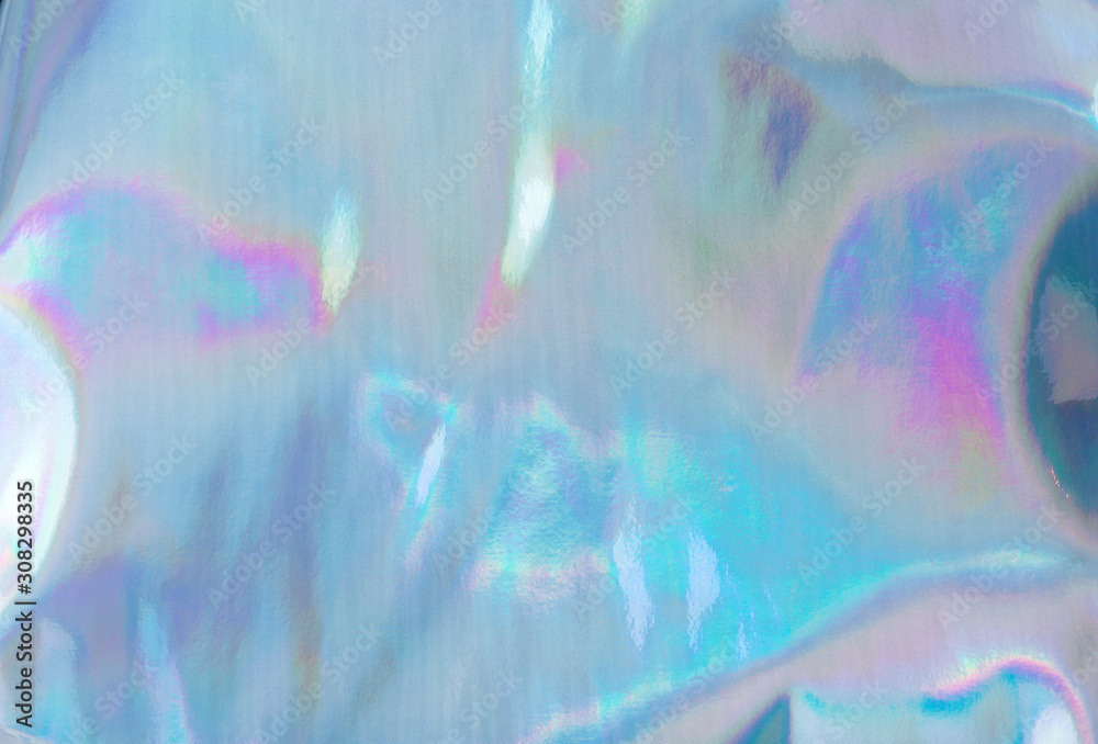 Holographic Foil Texture. Abstract soft pastel iridescent background. Rainbow color sunlight spots and gradient.