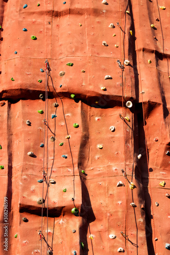 An artificial rock textured climbing wall background photo