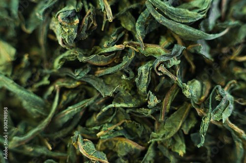 Close-up - collection of dried green tea leaves .Top view. Macro photo.