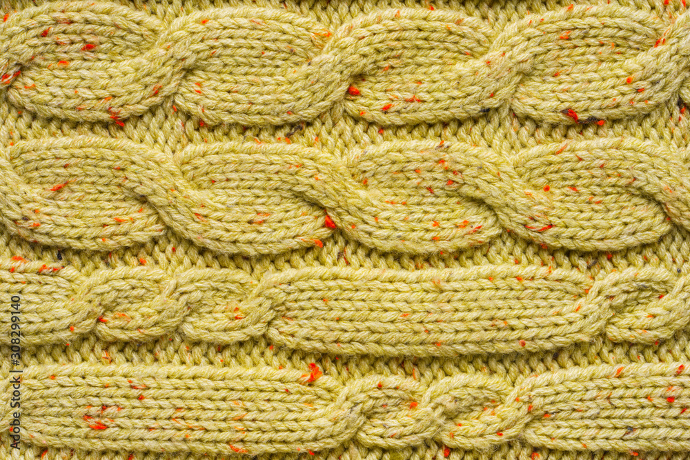 Texture of Wool Knit Color of Mustard Fabric Interspersed with Red Orange Yarn. Sweater Background Close-Up View