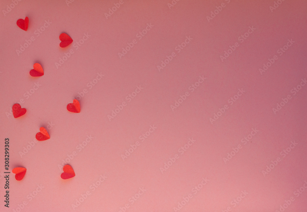 Hearts on a pink background. Valentin's Day, top view. Copy space. Flat lay. Greeting card.