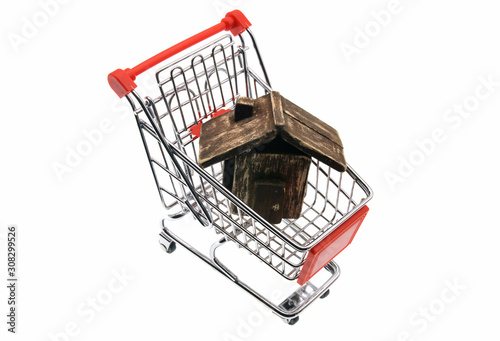 scale model of wooden house in shopping cart 