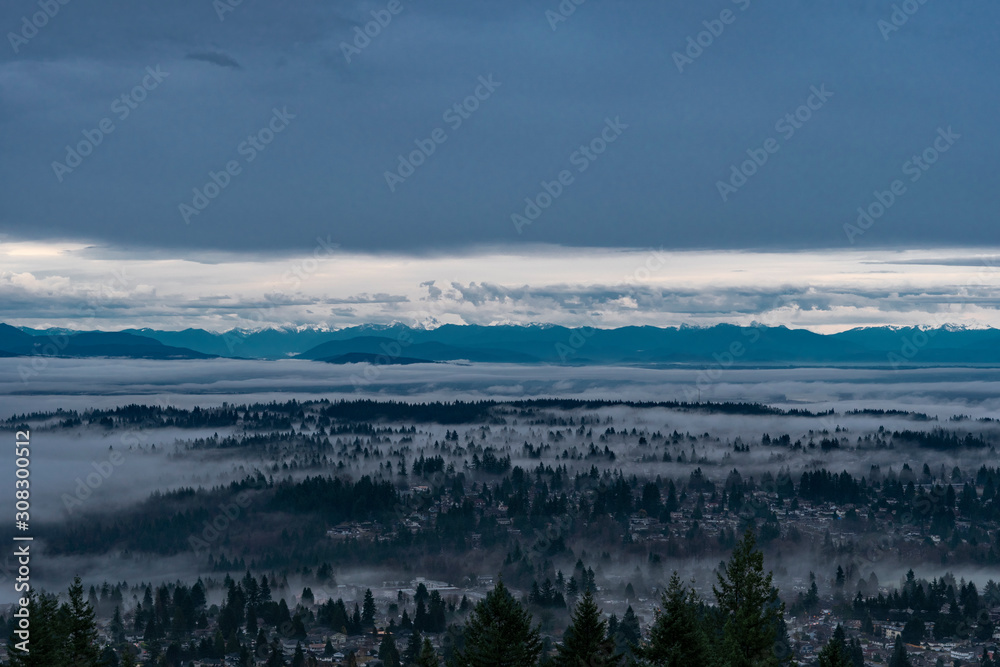 Port Moody homes emerging through cloud inversion over Fraser Valley - from Burnaby Mountain