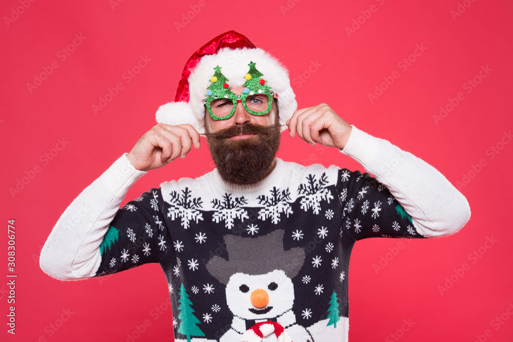 Christmas and New Year celebration. Happy bearded man with santa look. Santa man wear christmas tree party glasses. Holiday accessories christmas party. Well groomed mustache. Barbershop concept