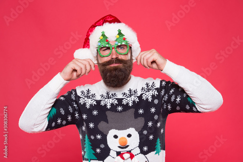 Christmas and New Year celebration. Happy bearded man with santa look. Santa man wear christmas tree party glasses. Holiday accessories christmas party. Well groomed mustache. Barbershop concept © be free