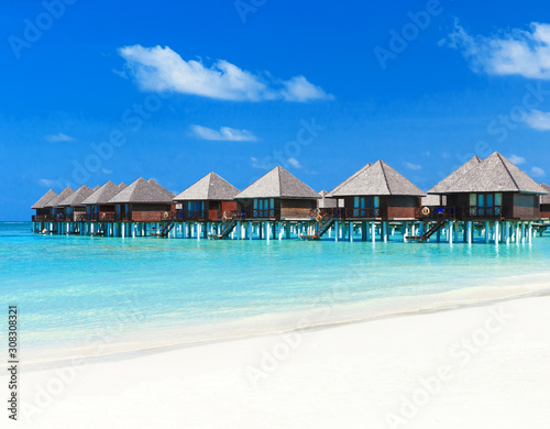 Beautiful beach with white sand. ocean, blue sky with clouds. Sunny day. Maldives tropical landscape