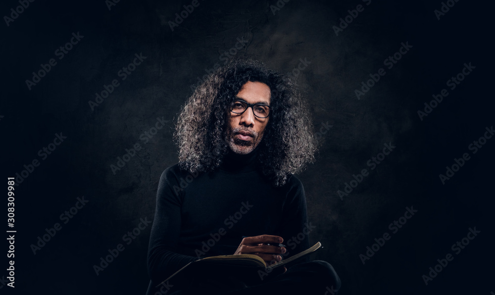 Talented writer is ready to present his new book, he is doing the last notes.
