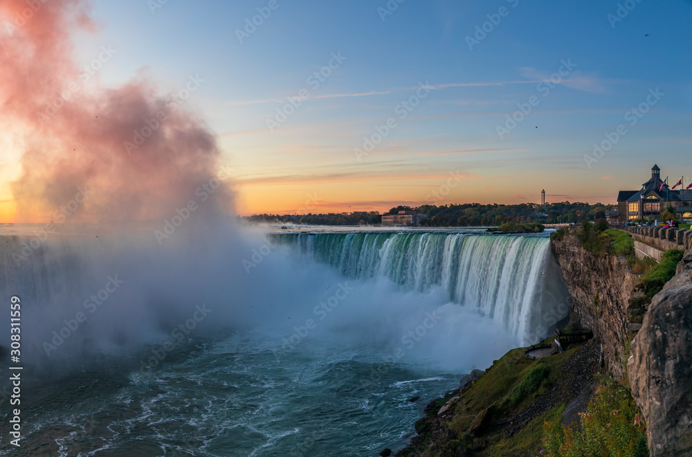 Niagara Falls is a group of three waterfalls at the southern end of Niagara Gorge, between the Canadian province of Ontario and the US state of New York Niagara Falls is a group of three waterfalls at the southern end of Niagara Gorge, between the Canadian province of Ontario and the US state of New York