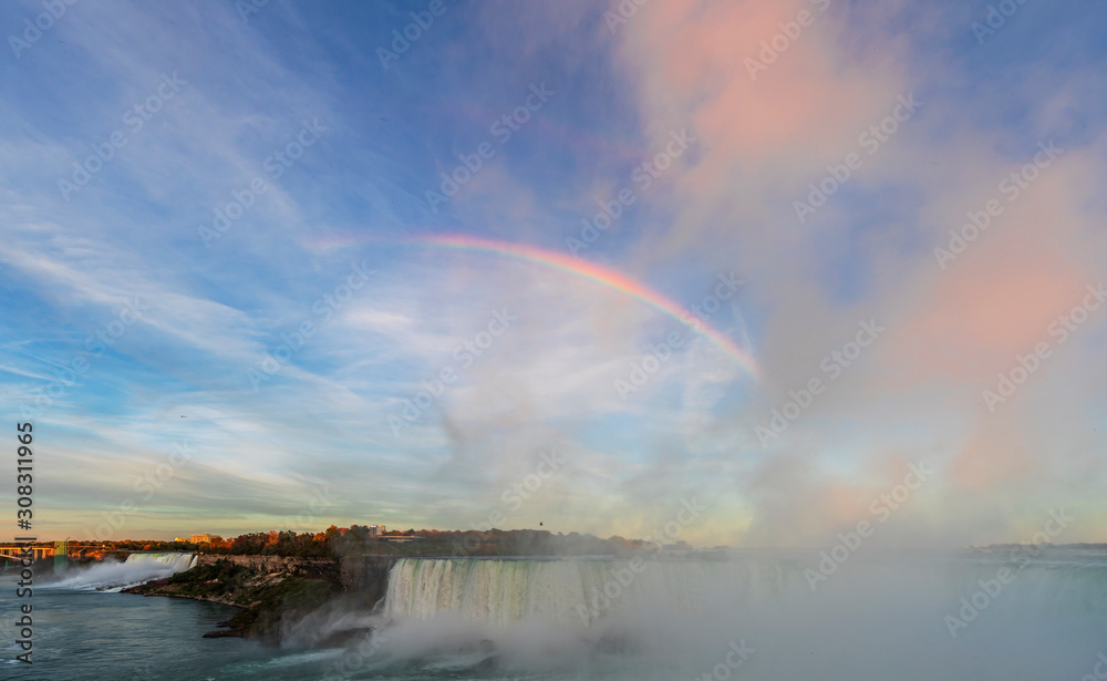 Niagara Falls is a group of three waterfalls at the southern end of Niagara Gorge, between the Canadian province of Ontario and the US state of New York Niagara Falls is a group of three waterfalls at the southern end of Niagara Gorge, between the Canadian province of Ontario and the US state of New York