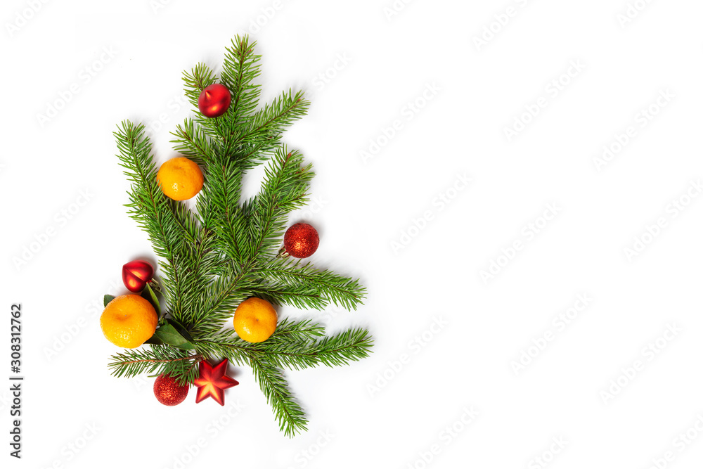 Christmas flatly copyspace. Sprigs of spruce, tangerines and red Christmas toys and on a white isolated background. Design elements. Holiday card.