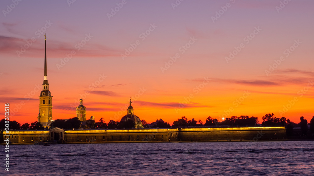 Peter and Paul Fortress against the backdrop of a crimson sky