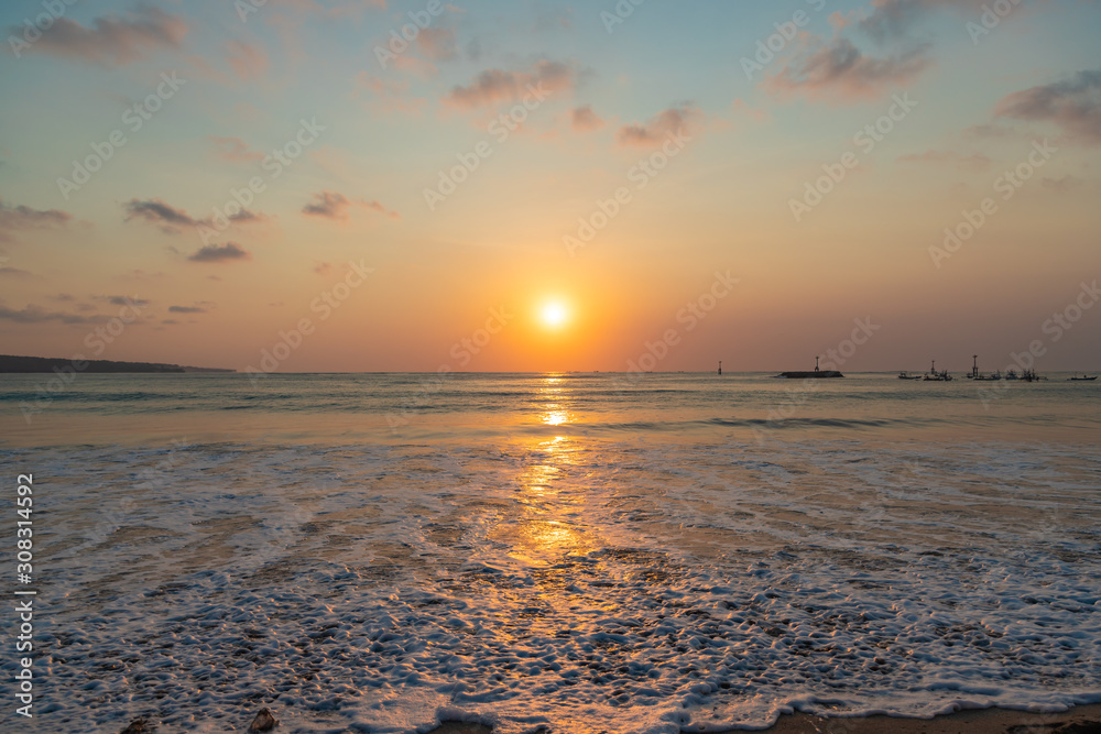 Naklejka premium Beautiful sunset scenery at Jimbaran beach, Bali island, Indonesia.