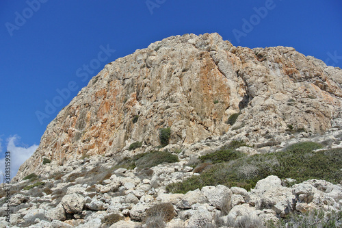 bottom up view of the mountain and cloudless summer sky