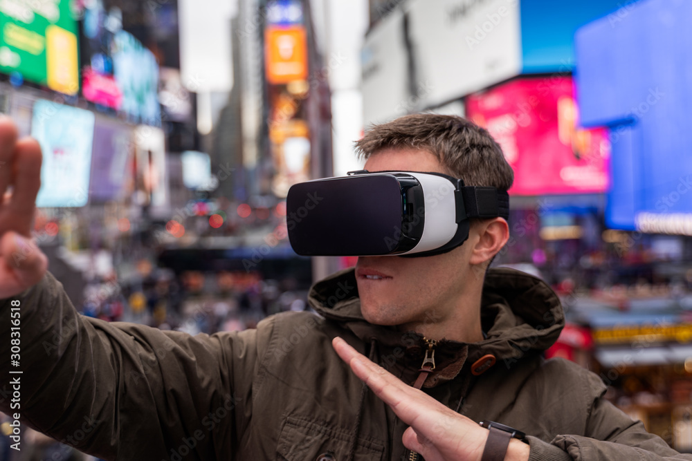 young man using VR in the city of new york