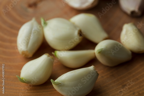 cloves of garlic - A pile of garlic seeds in a random pattern having their skin peeled off
